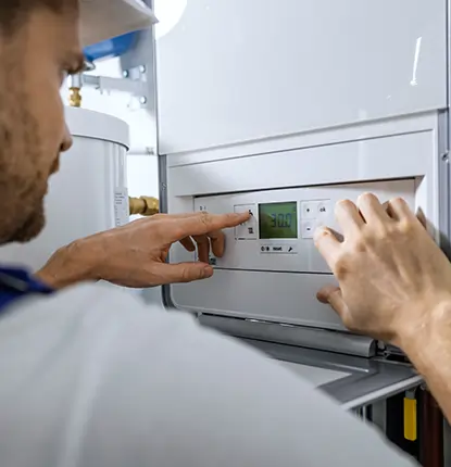 Technician checking thermostat 