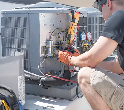 Technician performing exterior maintenance 